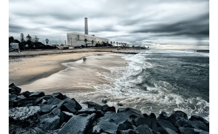 Carlsbad power plant with waves and clouds