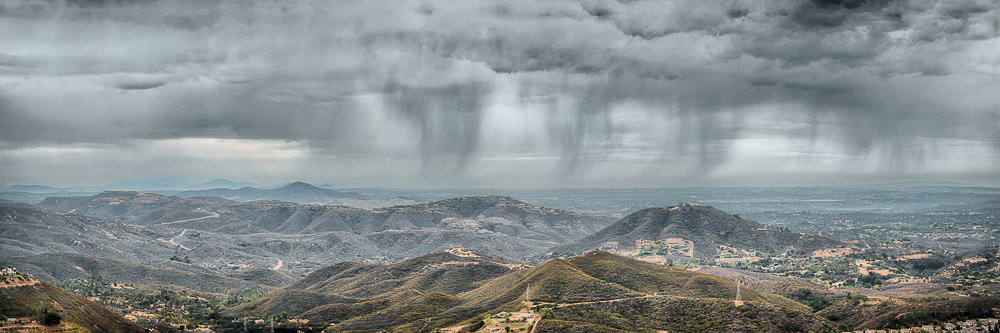 rain falling from gray clouds over San Diego north county