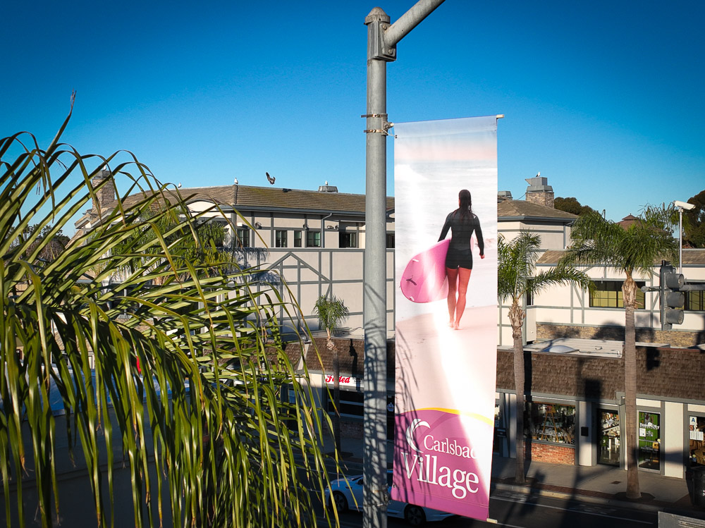 surfer girl on banner in downtown carlsbad 1