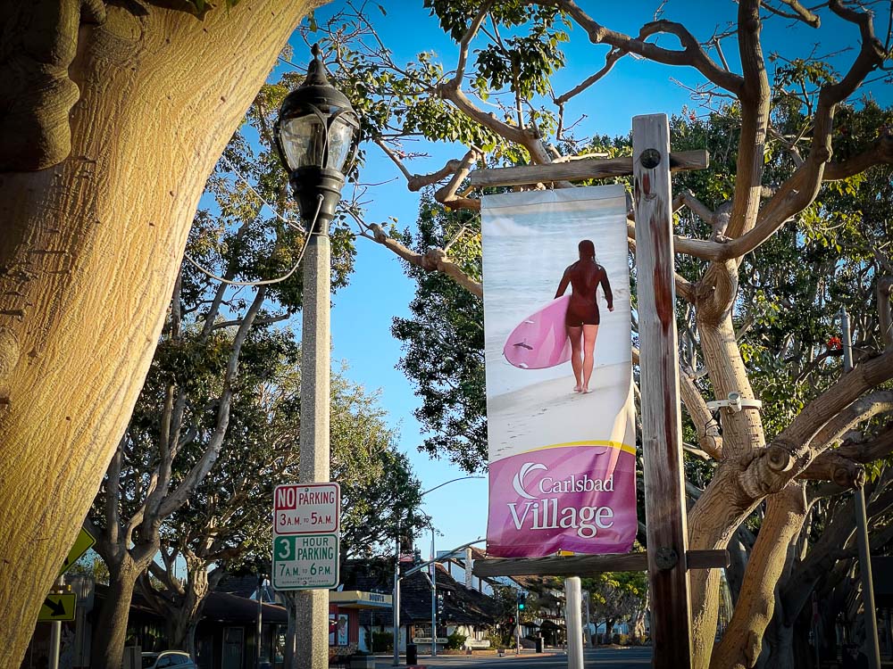 surfer girl on banner in downtown carlsbad 2